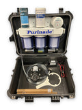 Purinade Five-Barrier water filtration system in an open hard case with pump, hoses and spare replacement filter cartridges