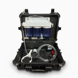 Purinade Five-Barrier system open, front view, showing three clear filter housings, 12V pump, hoses and power leads in a rugged hard case